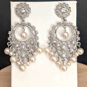 Silver open scroll work chandelier earrings with faux pears and cz